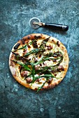Pizza with wild garlic and sausages