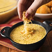 Broccoli and cheese soup topped with cheddar