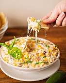 A cheese dip with corn, bacon and jalapenos (USA)