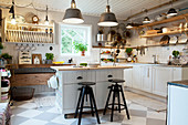 Chequered floor in rustic country-house kitchen
