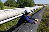 Worker checking gas pipeline