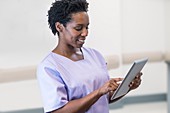 Woman nurse using tablet