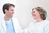 Doctor smiling at Woman patient