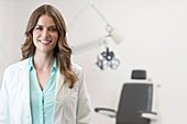 Female optician smiling towards camera