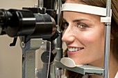 Mid adult woman having eye test