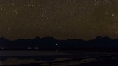 Atacama salt flat and mountains at night, time-lapse footage