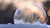 Ice crystals forming on a soap bubble