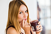 Woman eating jam
