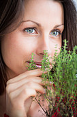 Woman inhaling thyme fragrance