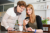 Teenager and elderly woman