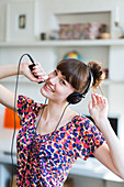 Woman listening to music on an ipod MP3 player