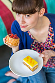 Woman eating pastry