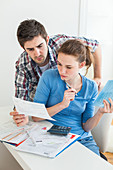 Young couple doing paperwork together