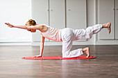 Woman practicing stretching exercises