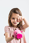 Girl with a piggy bank