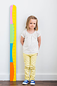 3-year-old girl measuring herself