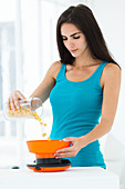 Woman weighing his food