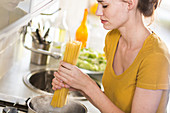 Woman preparing pasta