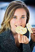 Woman eating a popcorn galette