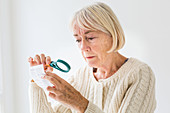 Woman using a magnifying glass