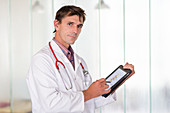 Doctor using a tablet PC
