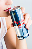 Woman drinking Red Bull