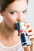 Woman drinking Red Bull