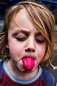 Boy with red tongue