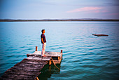 Man standing on lakeside