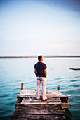 Man standing on lakeside