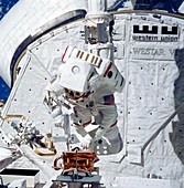Space Shuttle astronaut during spacewalk