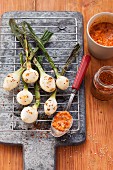 Grilled spring onions with Romesco tomato and red pepper sauce