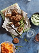 Crispy chicken nuggets with rocket quark and carrot salad