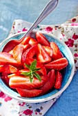 A bowl of fresh strawberries for dessert