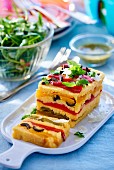 Polenta terrine with red pepper and olives