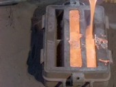 Pouring liquid iron into a mould