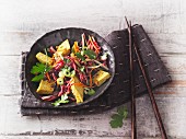 Asian coleslaw with red cabbage and celery with curry and mango tofu (Sirtfood)
