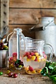 Russian hot drink kompot made from gooseberries, water and sugar