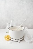 Making ricotta: Warm milk and lemon juice