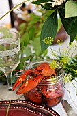 Lobsters with dill blossoms in a glass