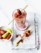 A tofu cream and banana smoothie with dates on a skewer
