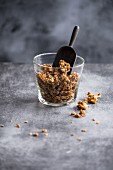 Muesli in a glass with a scoop