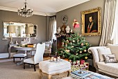 Christmas tree and antiques in classic living room