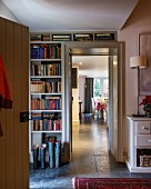 Fitted book shelves in foyer with view through to dining room