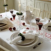 Wreaths of leaves as linen napkins on festively set table