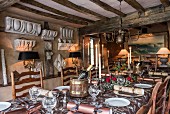 Festively set table in rustic living room