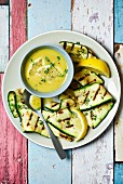 Grilled courgette strips with lemon sauce