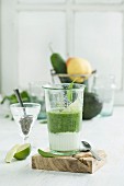 Green smoothie, ingredients, chia seeds, yogurt, spinach, avocado, cucumber, pear and lime