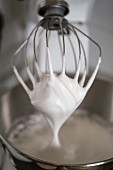 Whipped cream on a whisk