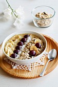 Smoothie bowl with banana, grapevine and oat cocos topping
